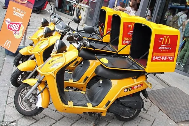 Yellow McDonald's motorcycle delivery in Seoul