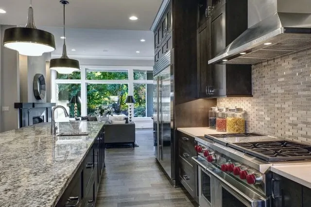 Large kitchen with stainless steel appliances and granite countertops