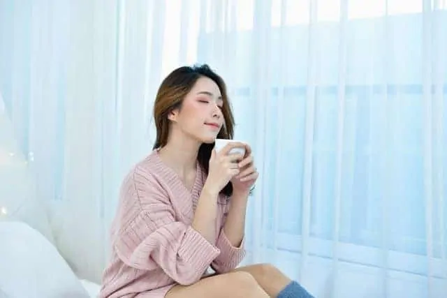 Woman Drinking a Hot Drink