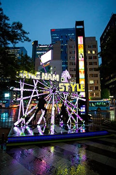 Gangnam Style sign lit up at night near Gangnam Station in Seoul, South Korea