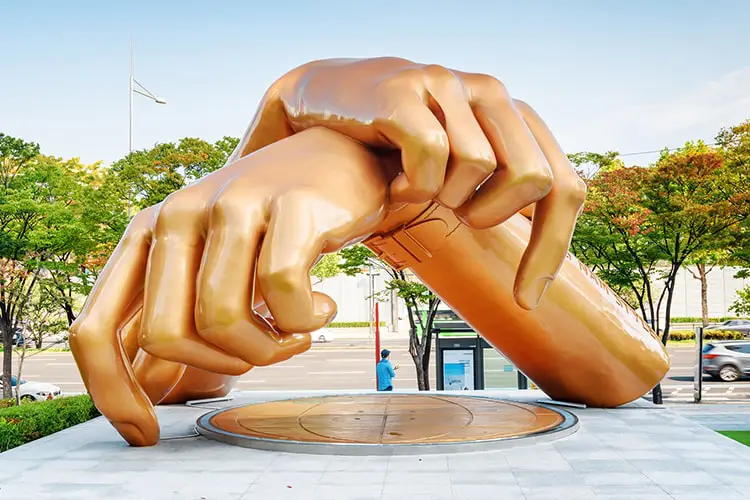 Statue of two golden hands in Seoul