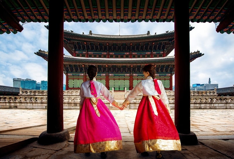 Korean Lady In Hanbok Or Korea Dress And Walk In An Ancient Town