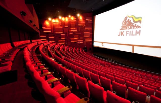 Korean cinema theater with the text JK Film on the screen