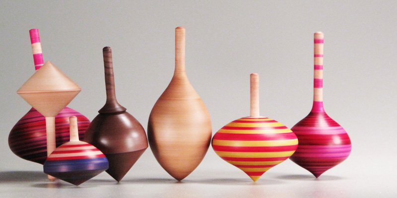 Seven colorful Spinning Tops