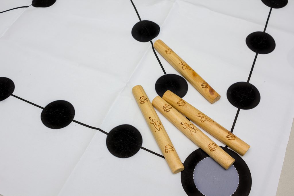 Korean traditional game yut nori game background and wooden sticks