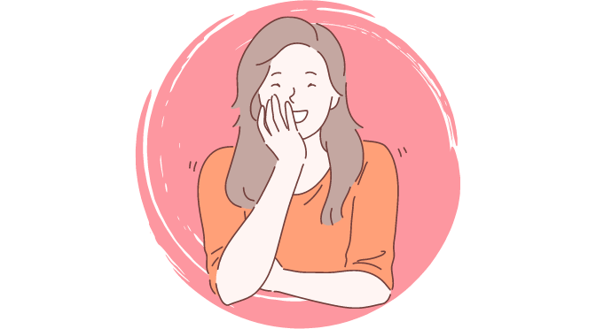 A woman covering her mouth when laughing