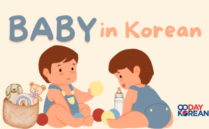 Two babies facing each other while playing with toys